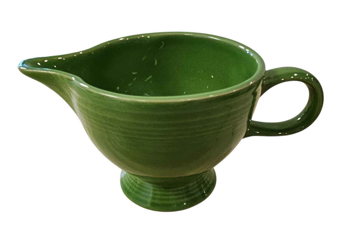 This is a Fiesta Fiestaware individual cream pitcher creamer in Shamrock. lead-free, Post 1986, Retired Color Retired Shape
