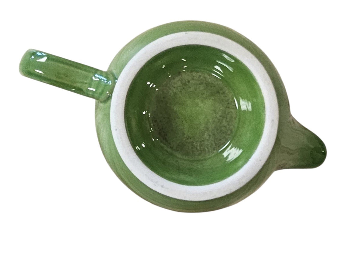 This is a Fiesta Fiestaware individual cream pitcher creamer in Shamrock. lead-free, Post 1986, Retired Color Retired Shape
