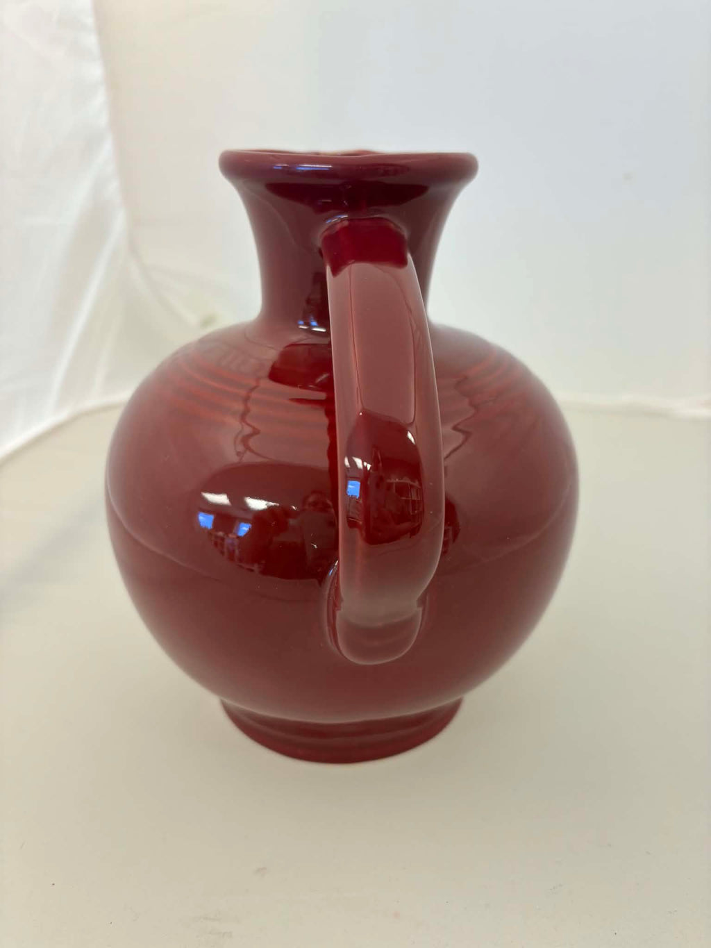 This is a Fiesta Fiestware small 60 Ounce Carafe in cinnabar. Lead-free Post 1986 Retired color retired shape
