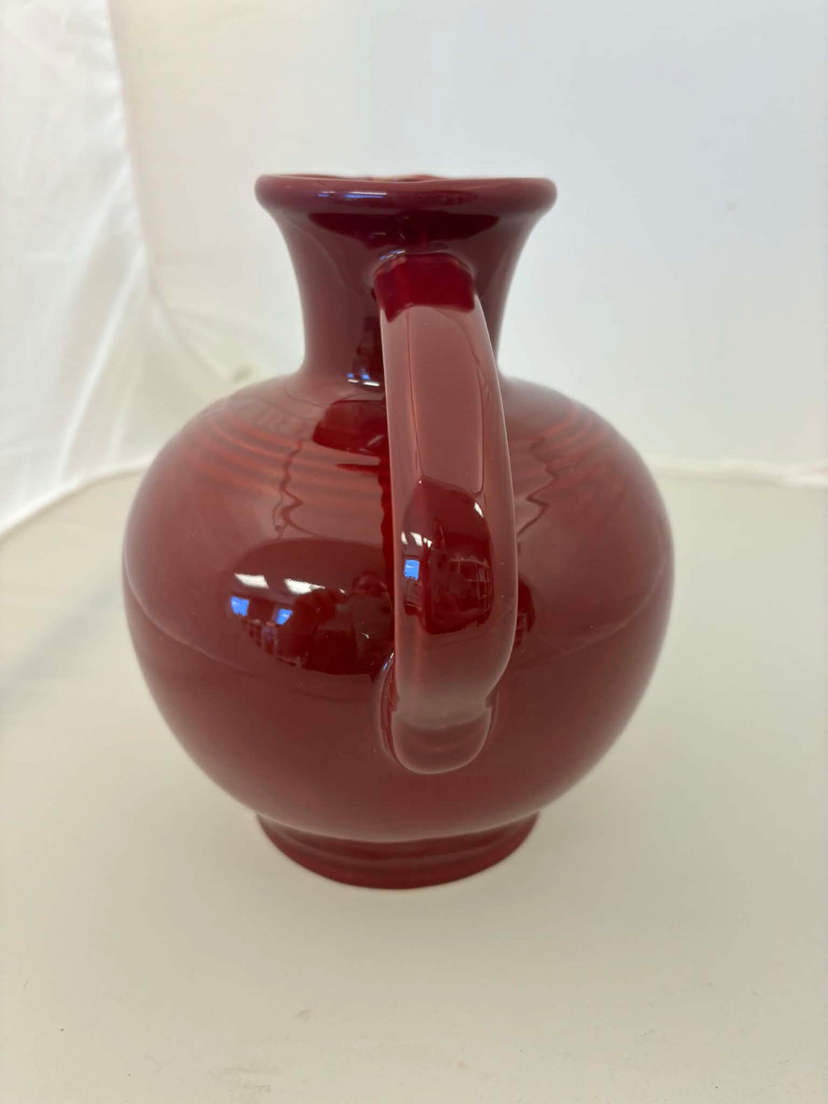 This is a Fiesta Fiestware small 60 Ounce Carafe in cinnabar. Lead-free Post 1986 Retired color retired shape
