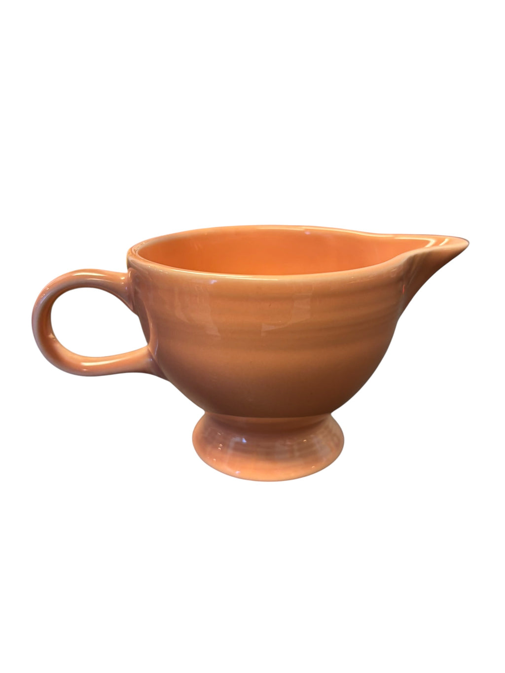 This is a Fiesta Fiestaware individual cream pitcher creamer in Apricot. lead-free, Post 1986, Retired Color Retired Shape