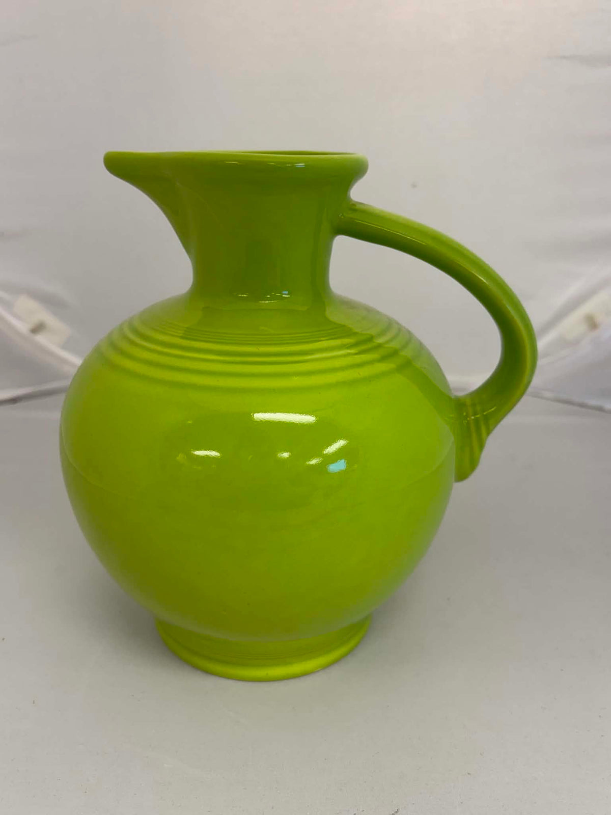 This is a Fiesta Fiestware small 60 Ounce Carafe in chartreuse. Lead-free Post 1986 Retired color retired shape
