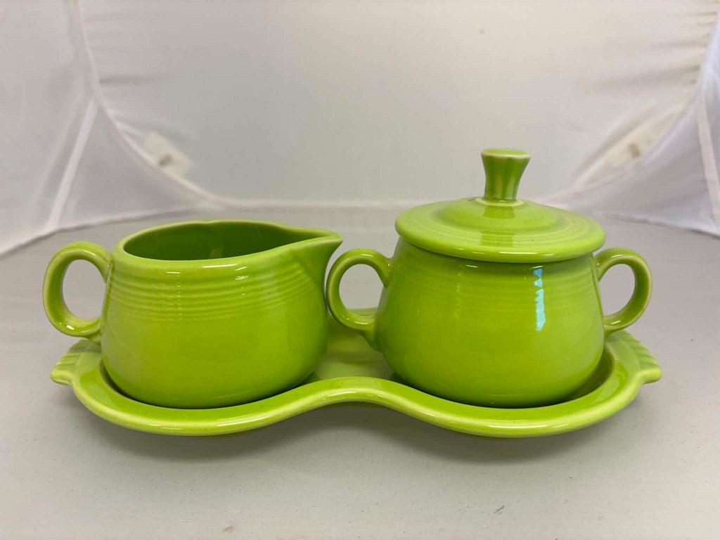This is a Fiesta Fiestaware Creamer Pitcher Sugar Bowl with Lid on Figure Eight 8 Tray Set in chartreuse lead-free, Post 1986, Retired Color Retired Shape
