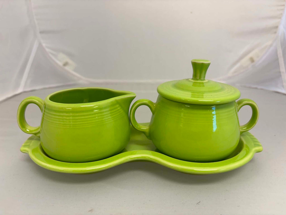 This is a Fiesta Fiestaware Creamer Pitcher Sugar Bowl with Lid on Figure Eight 8 Tray Set in chartreuse lead-free, Post 1986, Retired Color Retired Shape

