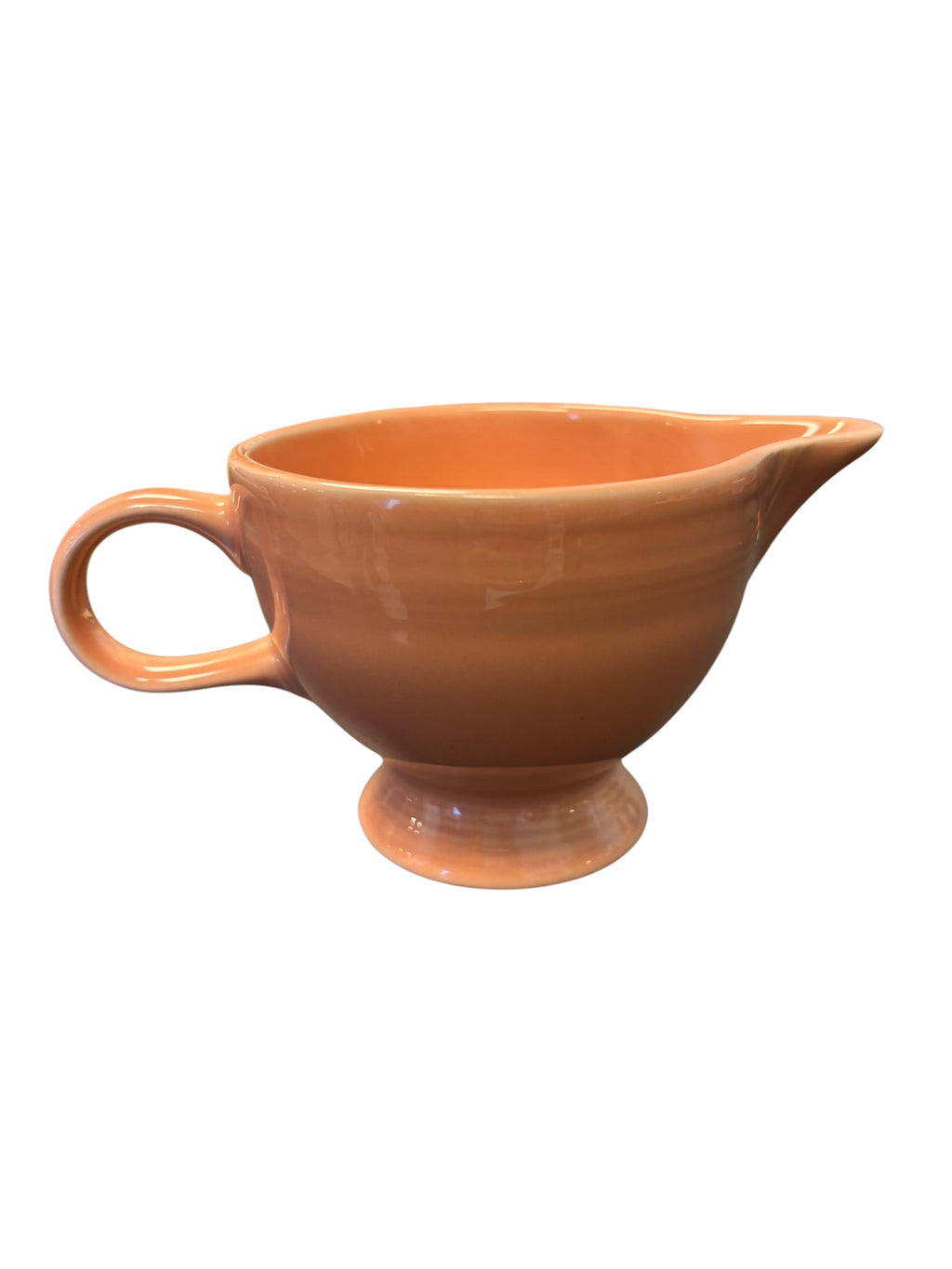 This is a Fiesta Fiestaware individual cream pitcher creamer in Apricot. lead-free, Post 1986, Retired Color Retired Shape