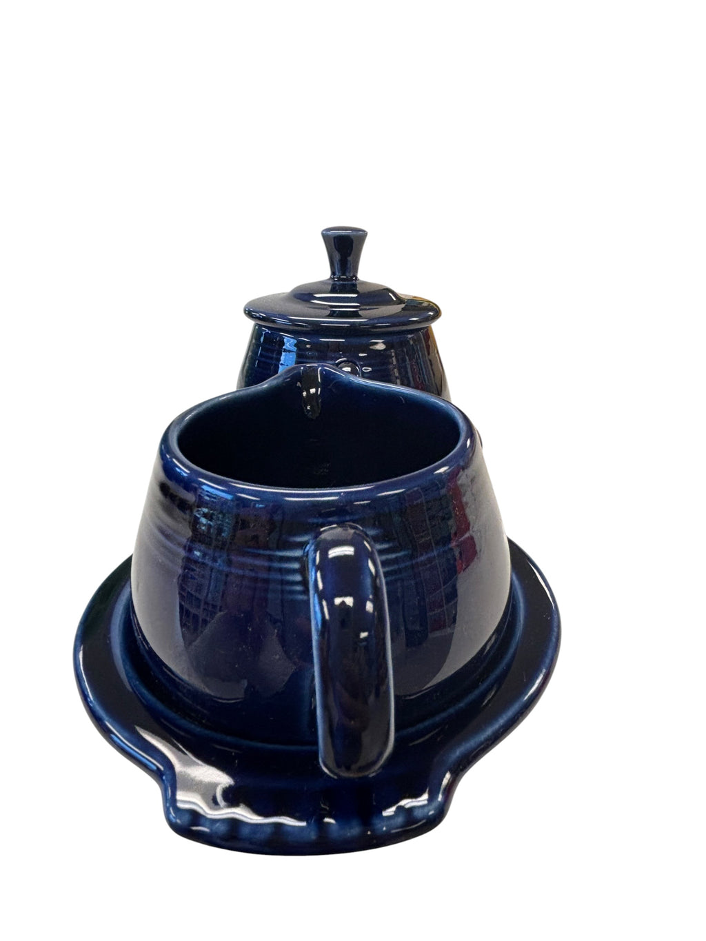 This is a Fiesta Fiestaware Creamer Pitcher Sugar Bowl with Lid on Figure Eight 8 Tray Set in cobalt lead-free, Post 1986, Retired Color Retired Shape
