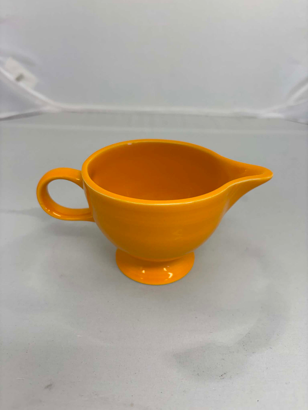 This is a Fiesta Fiestaware individual cream pitcher creamer in Butterscotch. lead-free, Post 1986, Retired Color Retired Shape New With Tags
