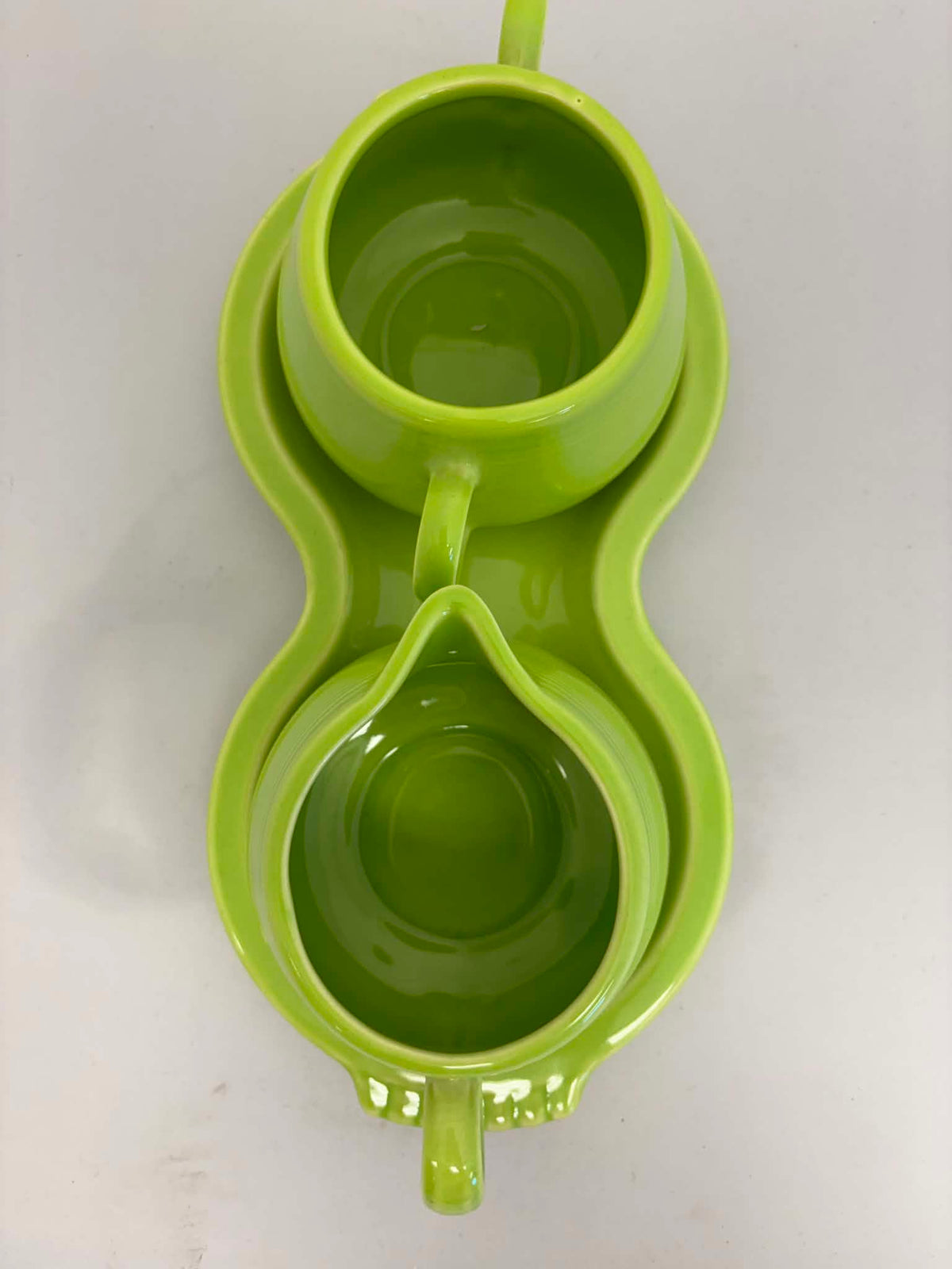 This is a Fiesta Fiestaware Creamer Pitcher Sugar Bowl with Lid on Figure Eight 8 Tray Set in chartreuse lead-free, Post 1986, Retired Color Retired Shape
