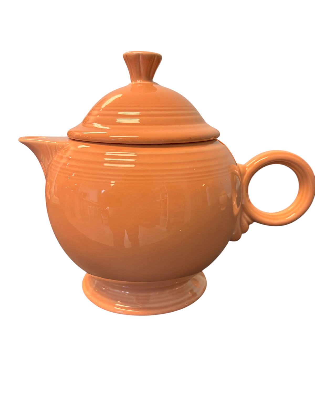 This is a Fiesta Fiestaware Five-cup 5-cup Ring Handled Tea Pot with Lid in Apricot. lead-free, Post 1986, Retired Color Retired Shape