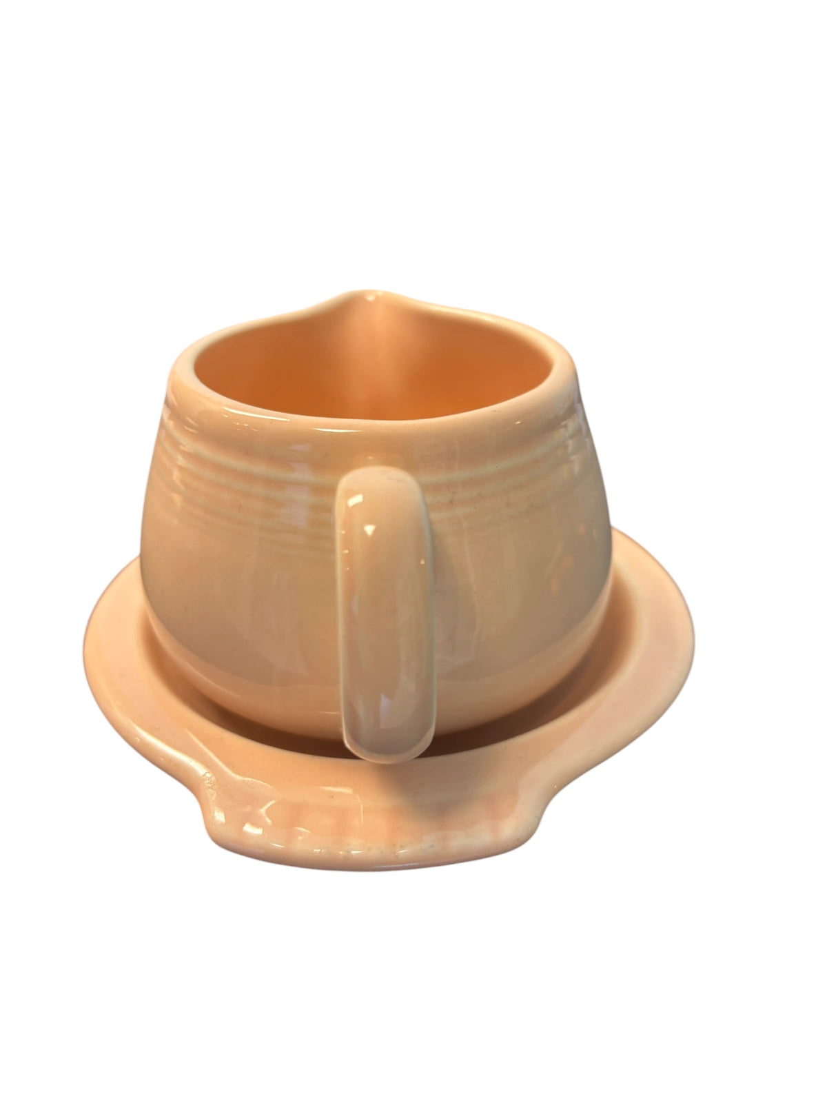 This is a Fiesta Fiestaware Creamer Pitcher Sugar Bowl with Lid on Figure Eight 8 Tray Set in apricot lead-free, Post 1986, Retired Color Retired Shape
