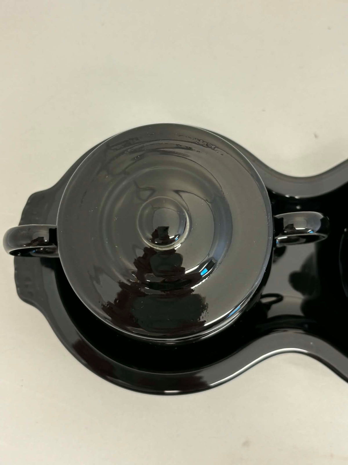 This is a Fiesta Fiestaware Creamer Pitcher Sugar Bowl with Lid on Figure Eight 8 Tray Set in black. lead-free, Post 1986, Retired Color Retired Shape
