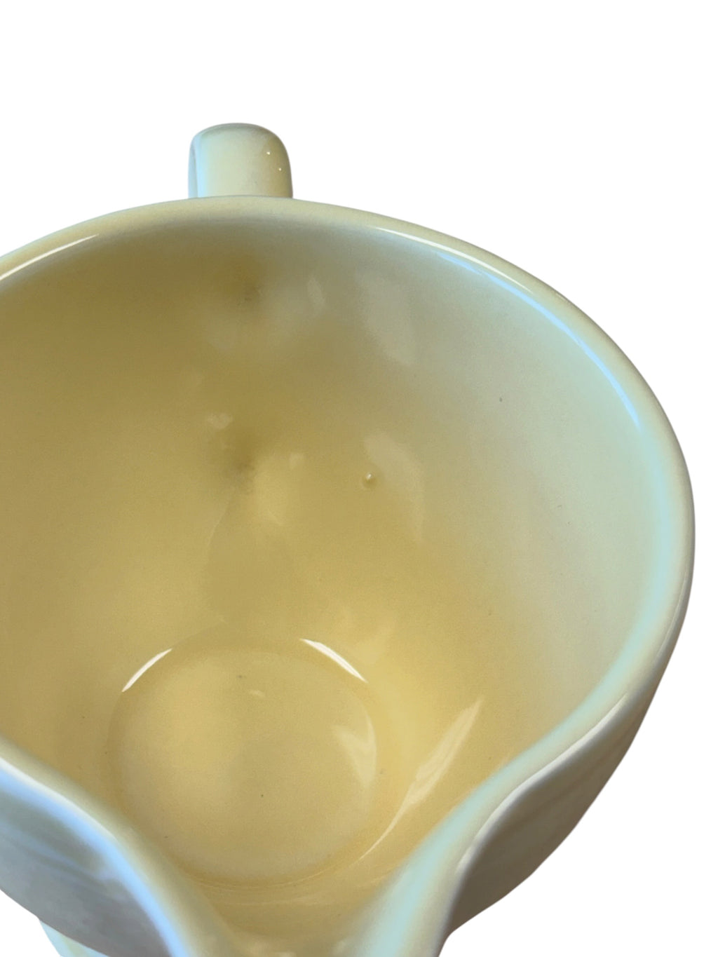 This is a Fiesta Fiestaware individual cream pitcher creamer in Yellow. lead-free, Post 1986, Retired Color Retired Shape
