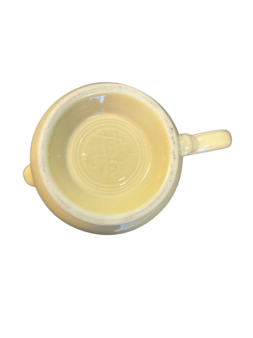 This is a Fiesta Fiestaware Five-cup 5-cup Ring Handled Tea Pot with Lid in Ivory. lead-free, Post 1986, Retired Color Retired Shape
