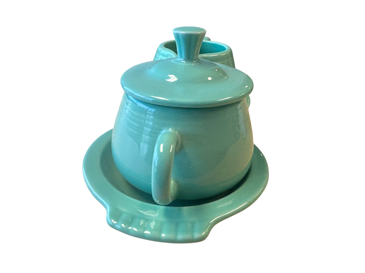 This is a Fiesta Fiestaware Creamer Pitcher Sugar Bowl with Lid on Figure Eight 8 Tray Set in Sea Mist Green. lead-free, Post 1986, Retired Color Retired Shape
