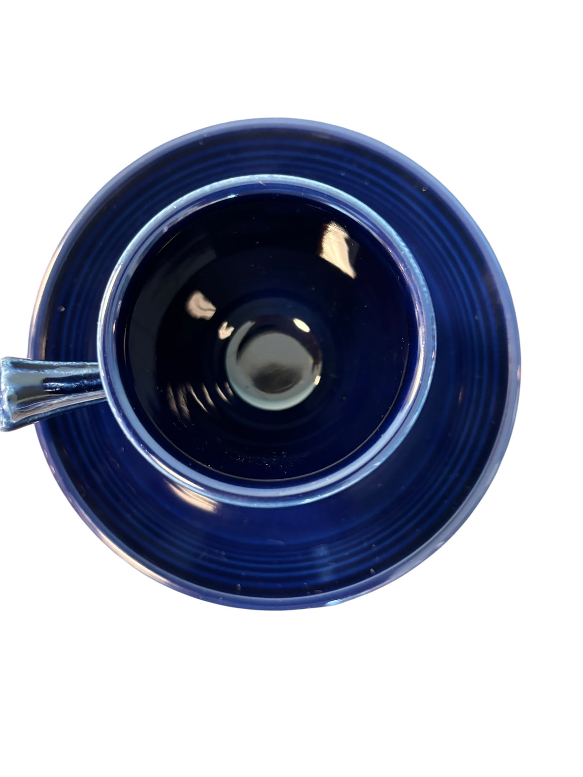 This is a Fiesta Fiestaware After Dinner AD Stick Handled Demitasse Demi Cup and Saucer Set in Cobalt. lead-free, Post 1986, Retired Color Retired Shape Perfect for Espresso
