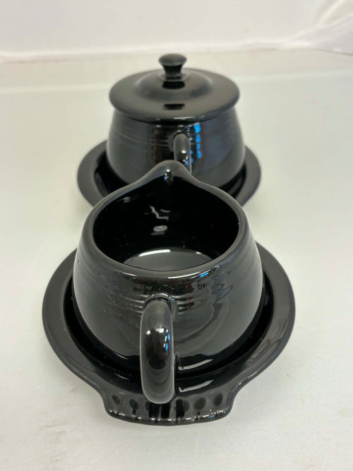 This is a Fiesta Fiestaware Creamer Pitcher Sugar Bowl with Lid on Figure Eight 8 Tray Set in black. lead-free, Post 1986, Retired Color Retired Shape
