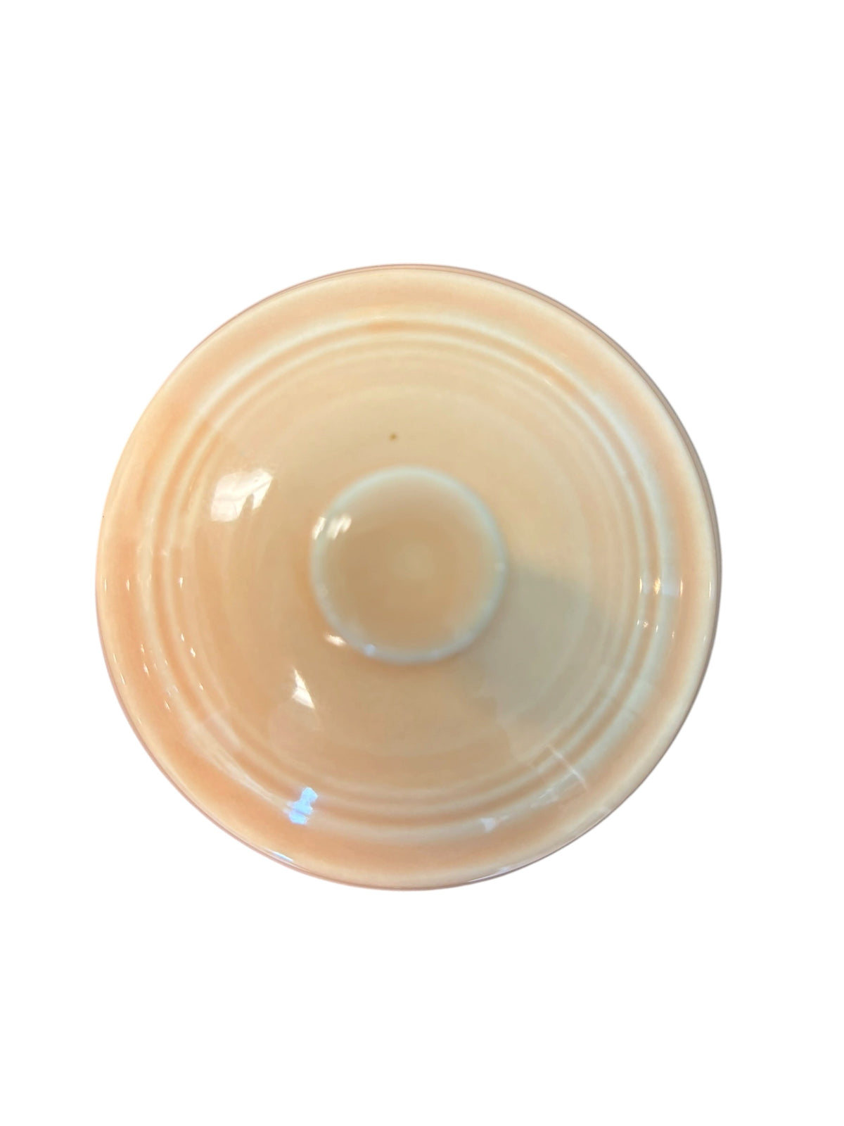 This is a Fiesta Fiestaware Individual Sugar Bowl With Lid in Apricot. lead-free, Post 1986, Retired Color Retired Shape
