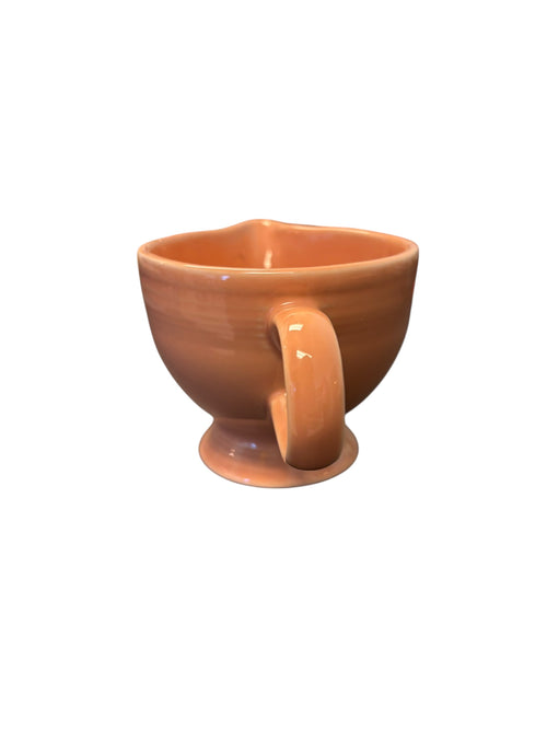 This is a Fiesta Fiestaware individual cream pitcher creamer in Apricot. lead-free, Post 1986, Retired Color Retired Shape