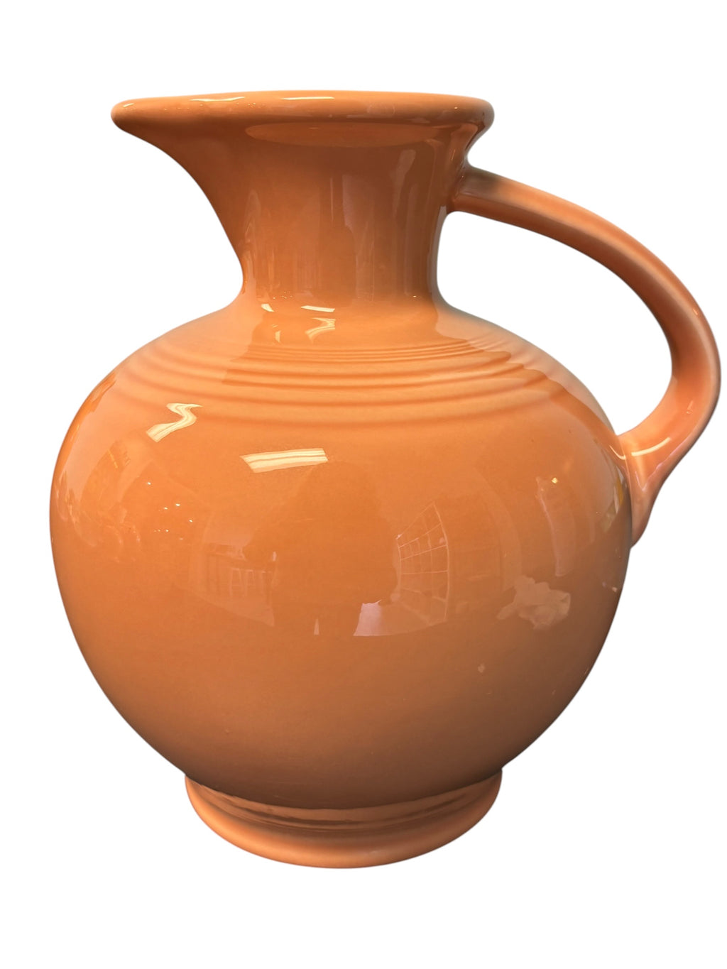 This is a Fiesta Fiestware small 60 Ounce Carafe in apricot. Lead-free Post 1986 Retired color retired shape