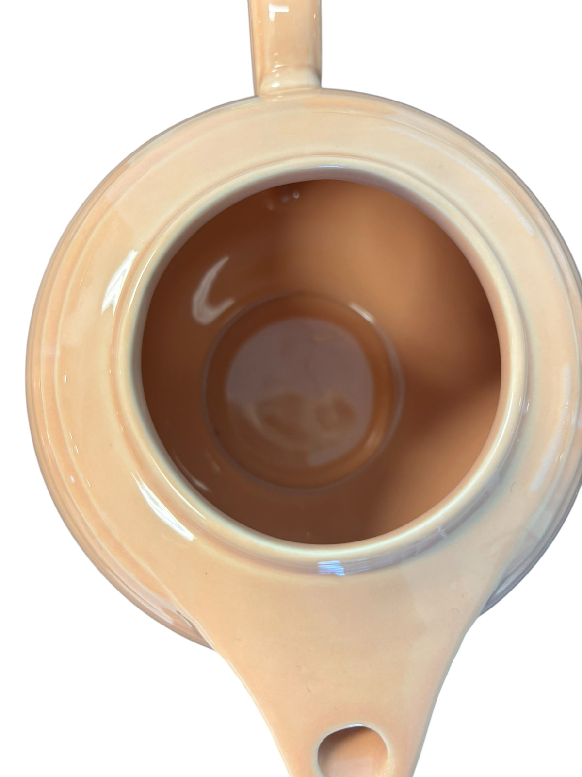 This is a Fiesta Fiestaware Five-cup 5-cup Ring Handled Tea Pot with Lid in Apricot. lead-free, Post 1986, Retired Color Retired Shape