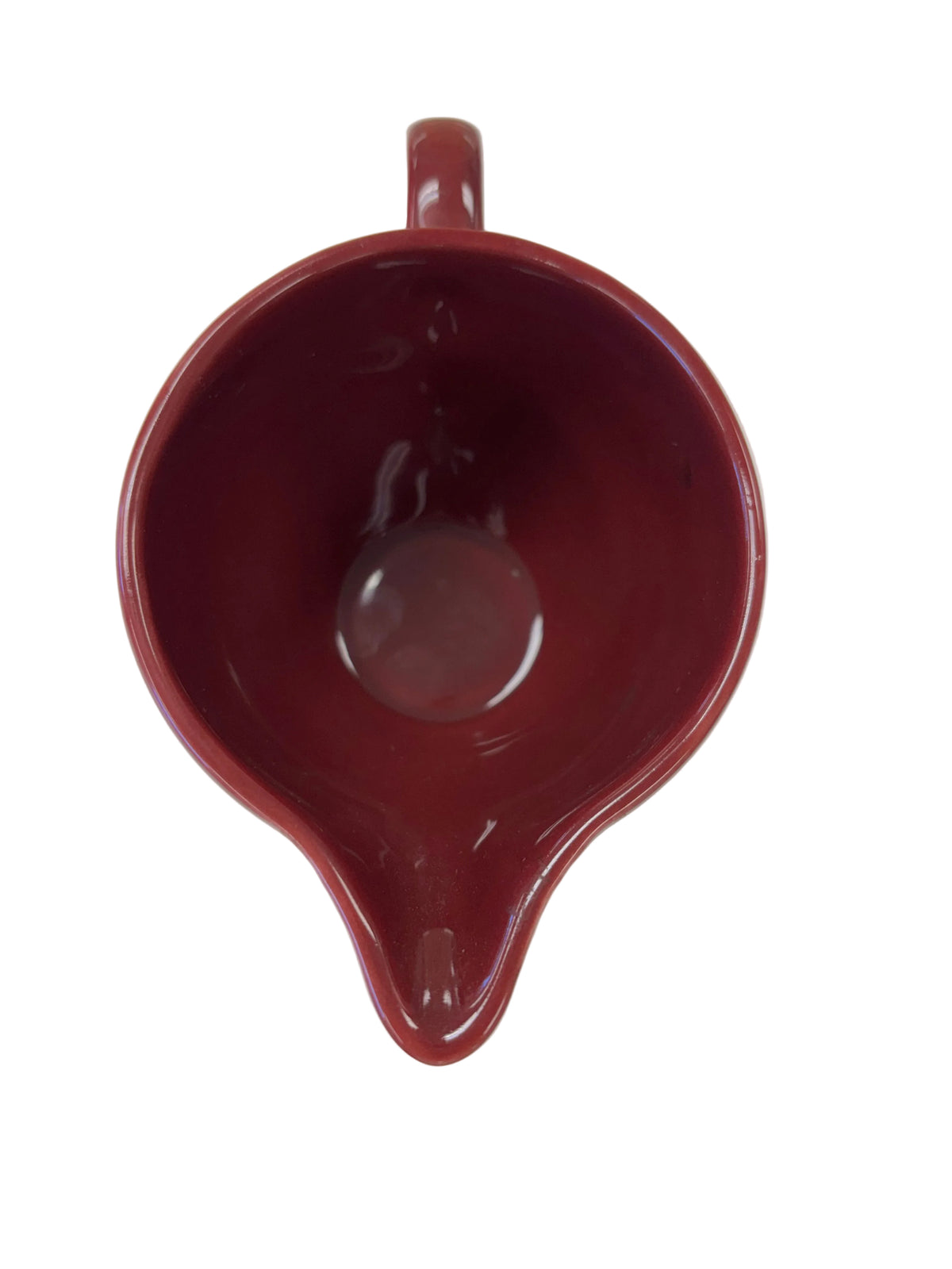 This is a Fiesta Fiestaware individual cream pitcher creamer in Cinnabar. lead-free, Post 1986, Retired Color Retired Shape
