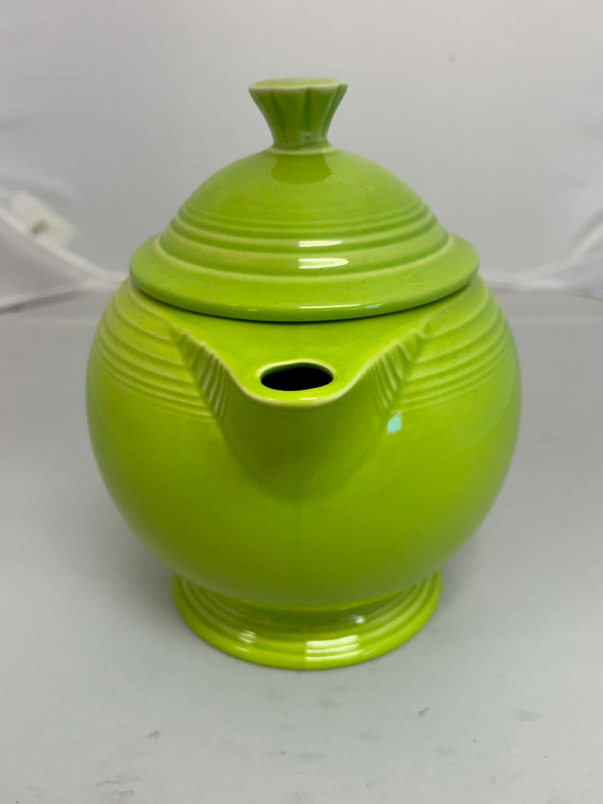 This is a Fiesta Fiestaware Five-cup 5-cup Ring Handled Tea Pot with Lid in Chartreuse. lead-free, Post 1986, Retired Color Retired Shape
