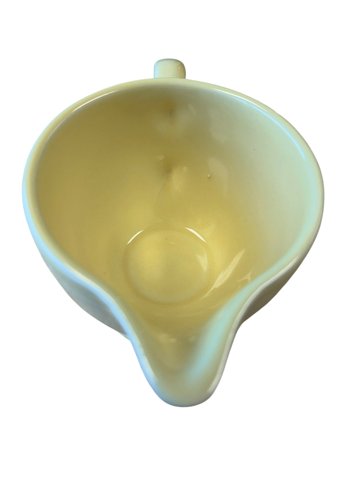 This is a Fiesta Fiestaware individual cream pitcher creamer in Yellow. lead-free, Post 1986, Retired Color Retired Shape
