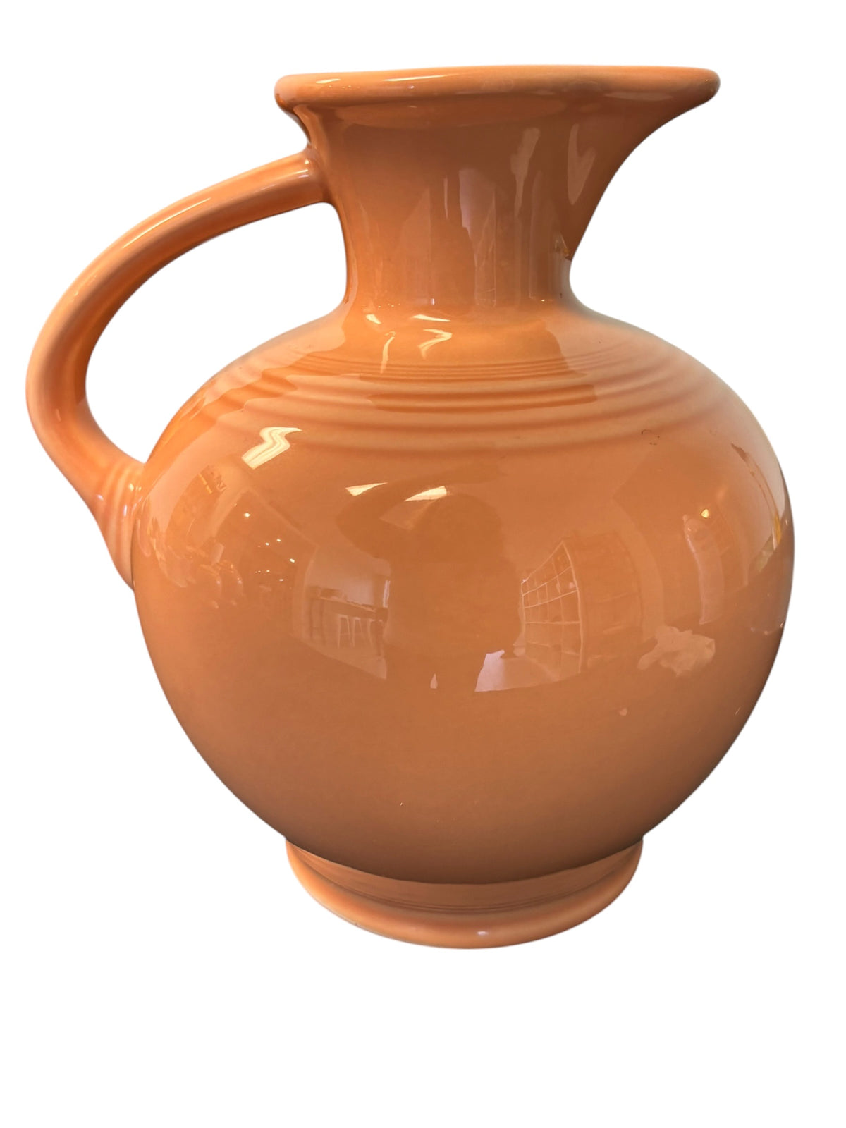 This is a Fiesta Fiestware small 60 Ounce Carafe in apricot. Lead-free Post 1986 Retired color retired shape
