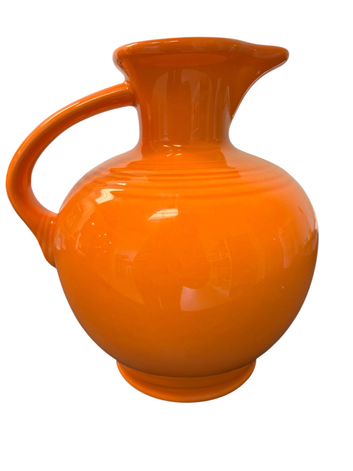 This is a Fiesta Fiestware small 60 Ounce Carafe in tangerine. Lead-free Post 1986 Retired color retired shape
