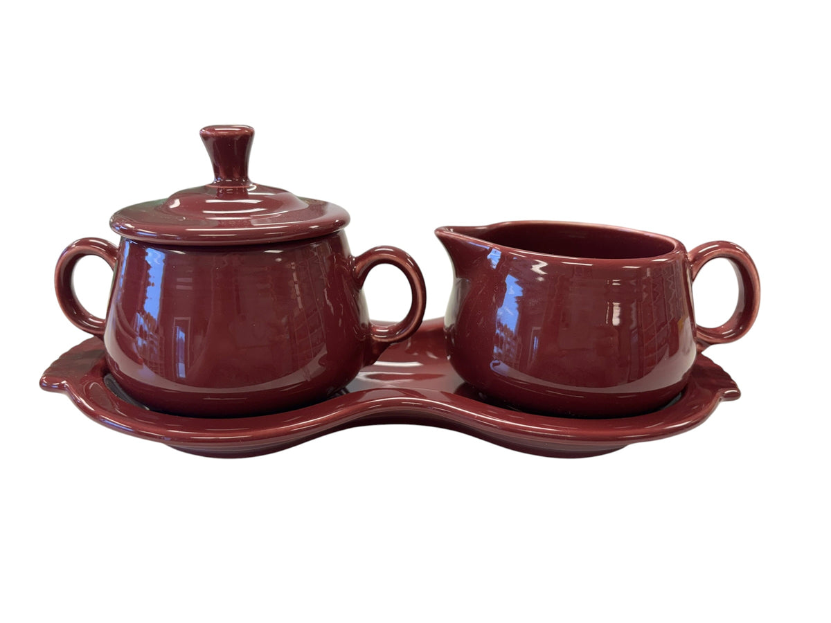 This is a Fiesta Fiestaware Creamer Pitcher Sugar Bowl with Lid on Figure Eight 8 Tray Set in cinnabar lead-free, Post 1986, Retired Color Retired Shape
