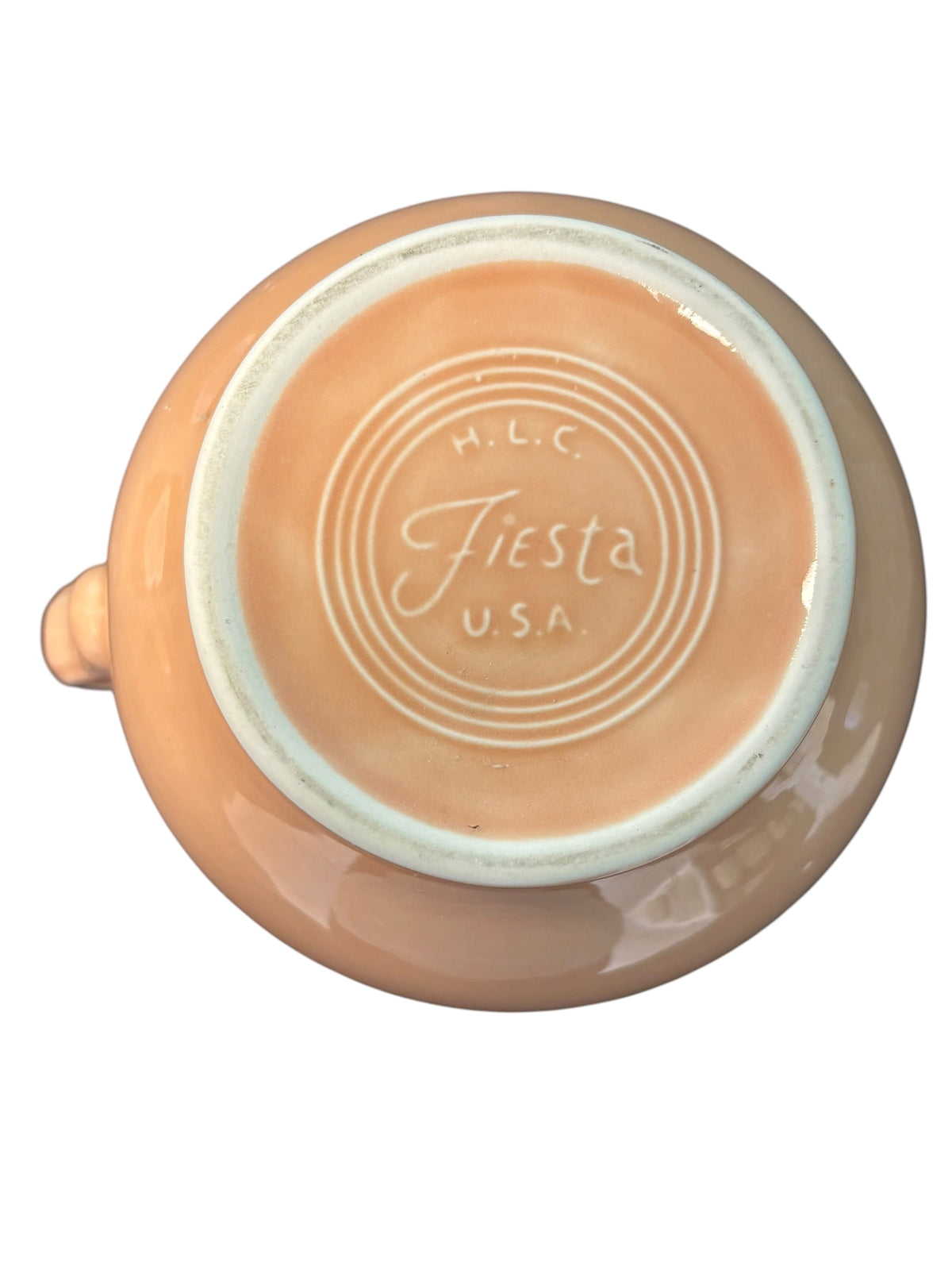 This is a Fiesta Fiestware small 60 Ounce Carafe in apricot. Lead-free Post 1986 Retired color retired shape
