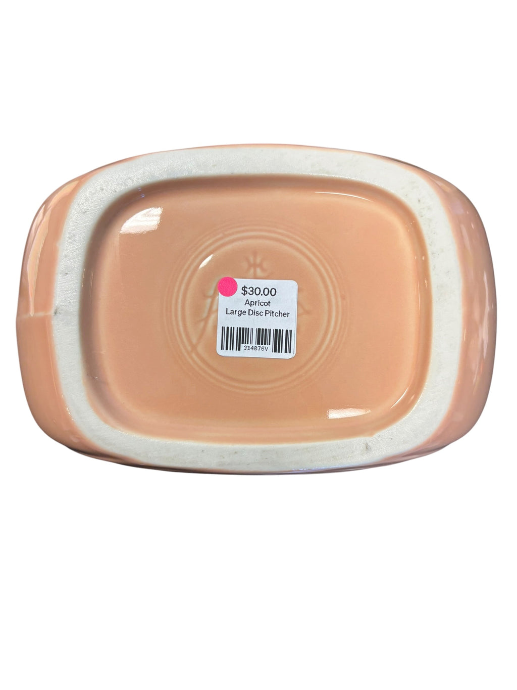 This is a Fiesta Fiestaware Large Disc Water Pitcher in Apricot. lead-free, Post 1986, Retired Color Retired Shape 67 ounce capacity