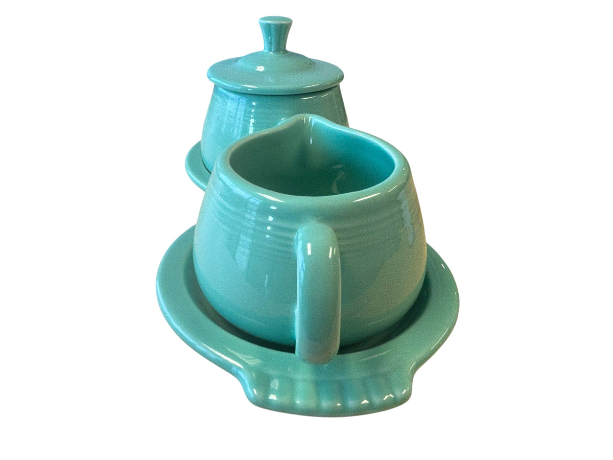 This is a Fiesta Fiestaware Creamer Pitcher Sugar Bowl with Lid on Figure Eight 8 Tray Set in Sea Mist Green. lead-free, Post 1986, Retired Color Retired Shape

