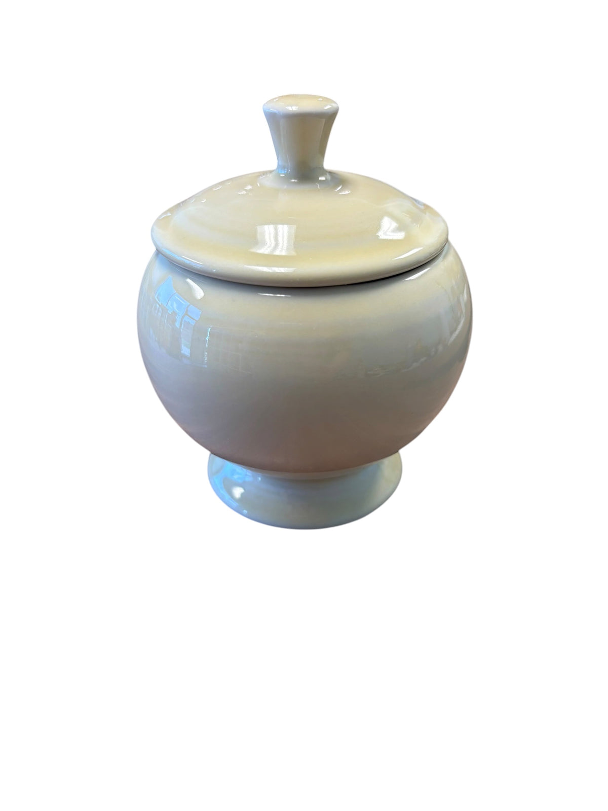 This is a Fiesta Fiestaware Individual Sugar Bowl With Lid in Ivory. lead-free, Post 1986, Retired Color Retired Shape
