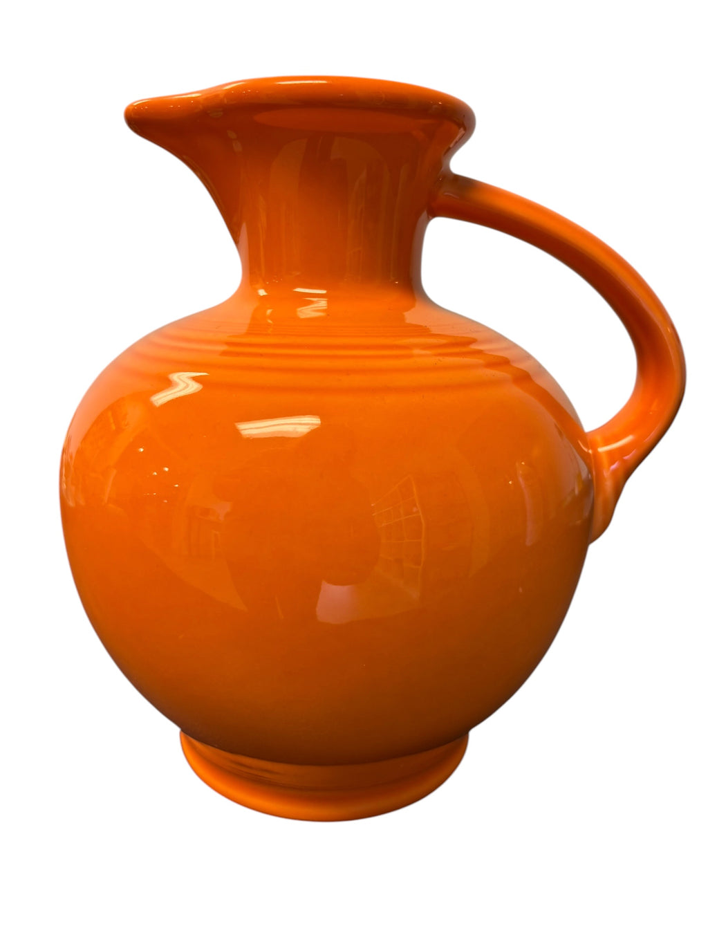 This is a Fiesta Fiestware small 60 Ounce Carafe in tangerine. Lead-free Post 1986 Retired color retired shape
