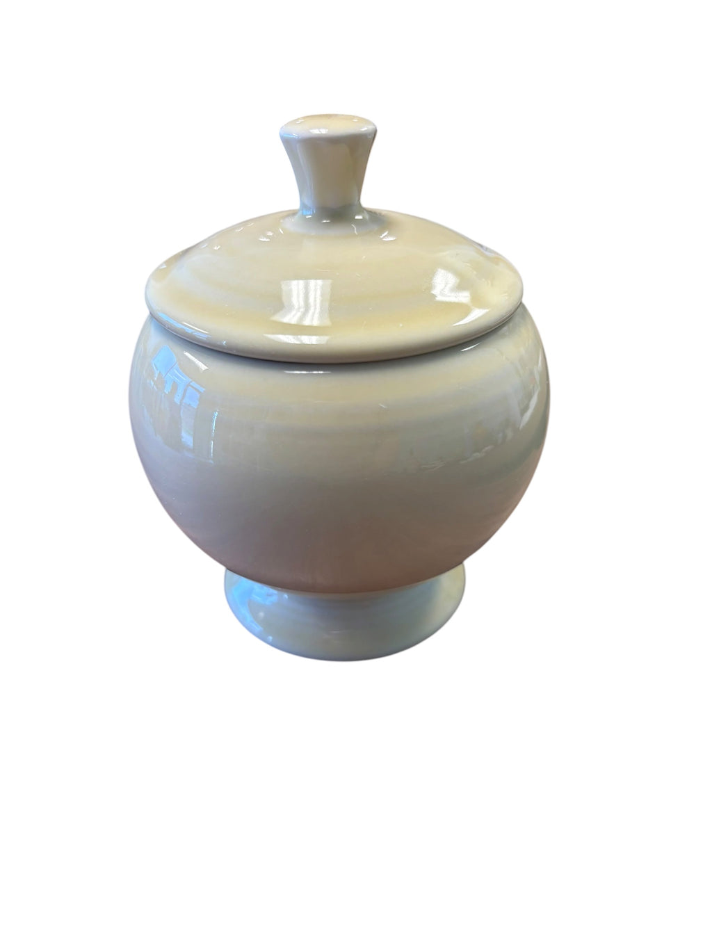 This is a Fiesta Fiestaware Individual Sugar Bowl With Lid in Ivory. lead-free, Post 1986, Retired Color Retired Shape
