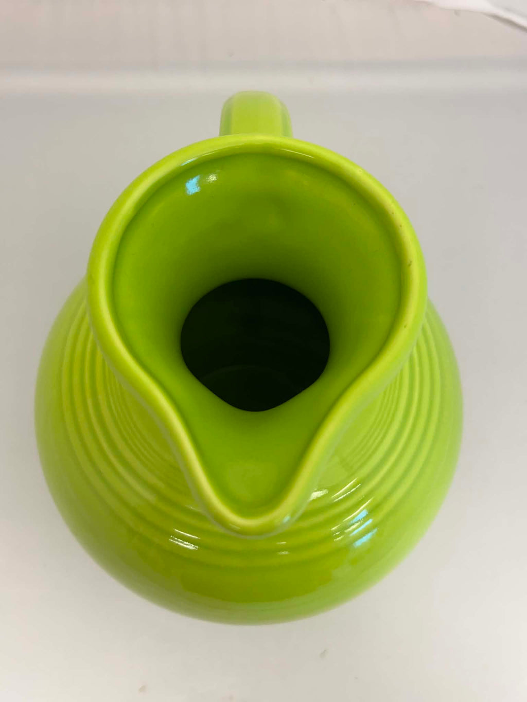 This is a Fiesta Fiestware small 60 Ounce Carafe in chartreuse. Lead-free Post 1986 Retired color retired shape
