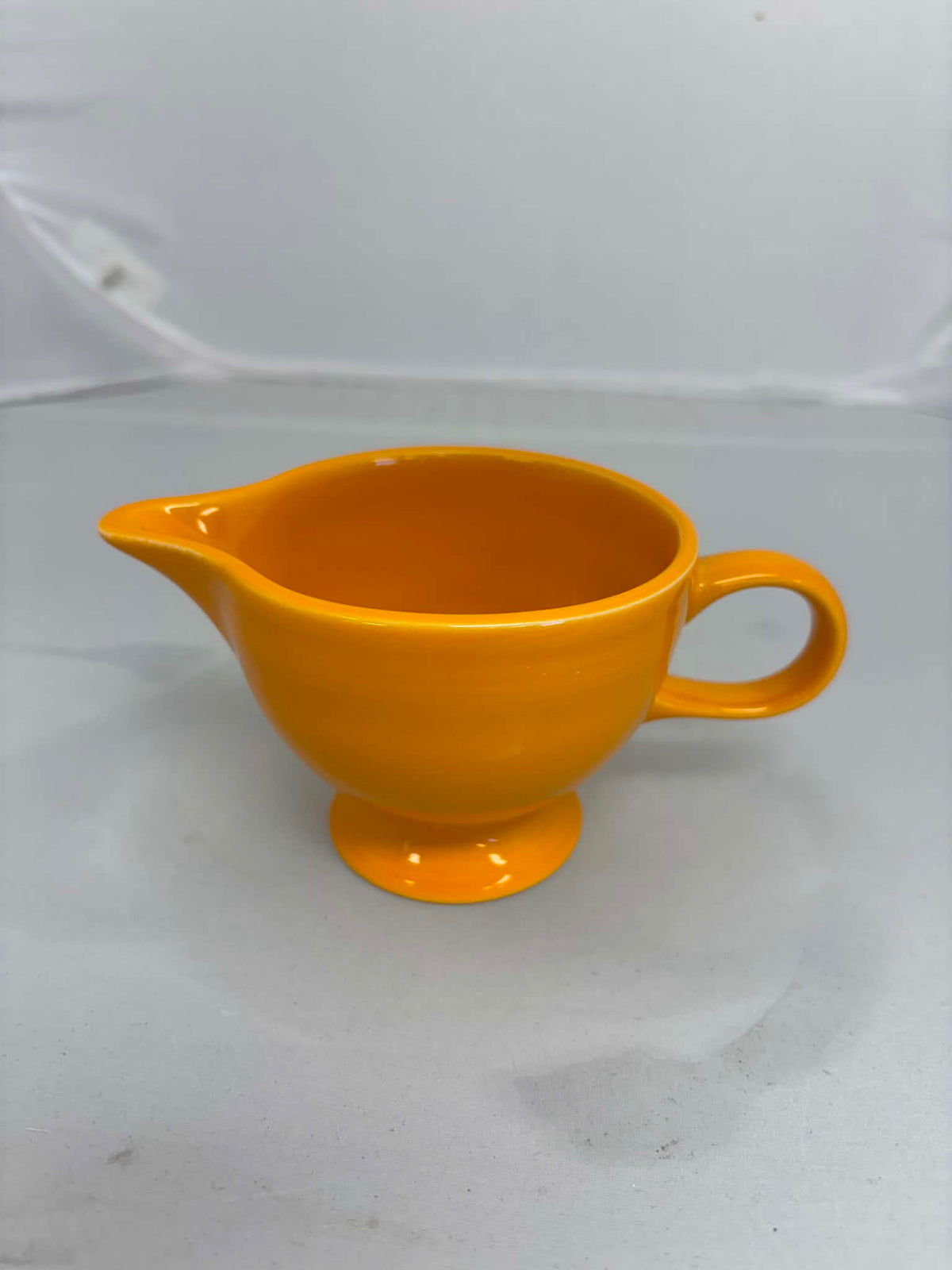 This is a Fiesta Fiestaware individual cream pitcher creamer in Butterscotch. lead-free, Post 1986, Retired Color Retired Shape New With Tags
