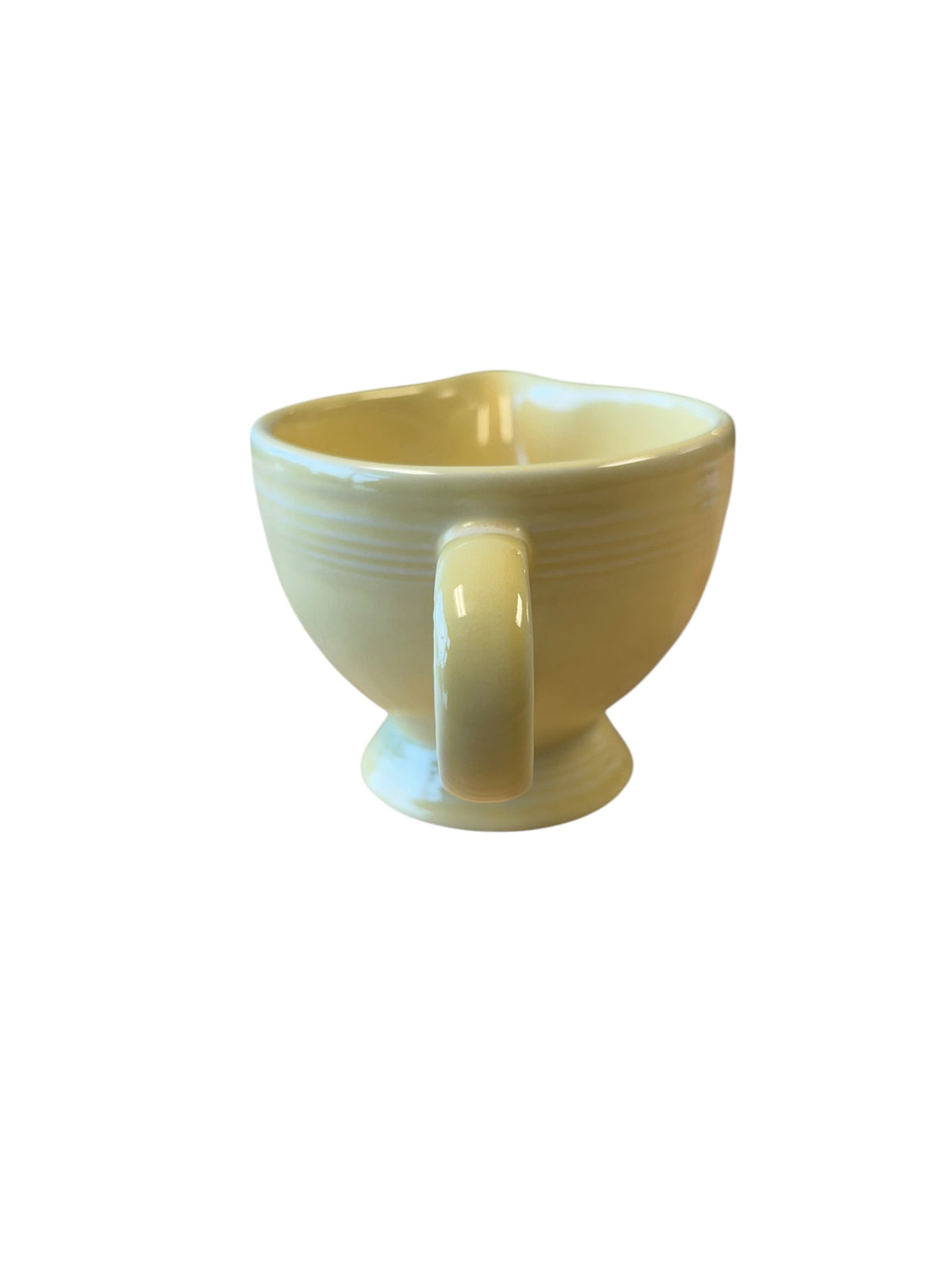 This is a Fiesta Fiestaware individual cream pitcher creamer in Yellow. lead-free, Post 1986, Retired Color Retired Shape
