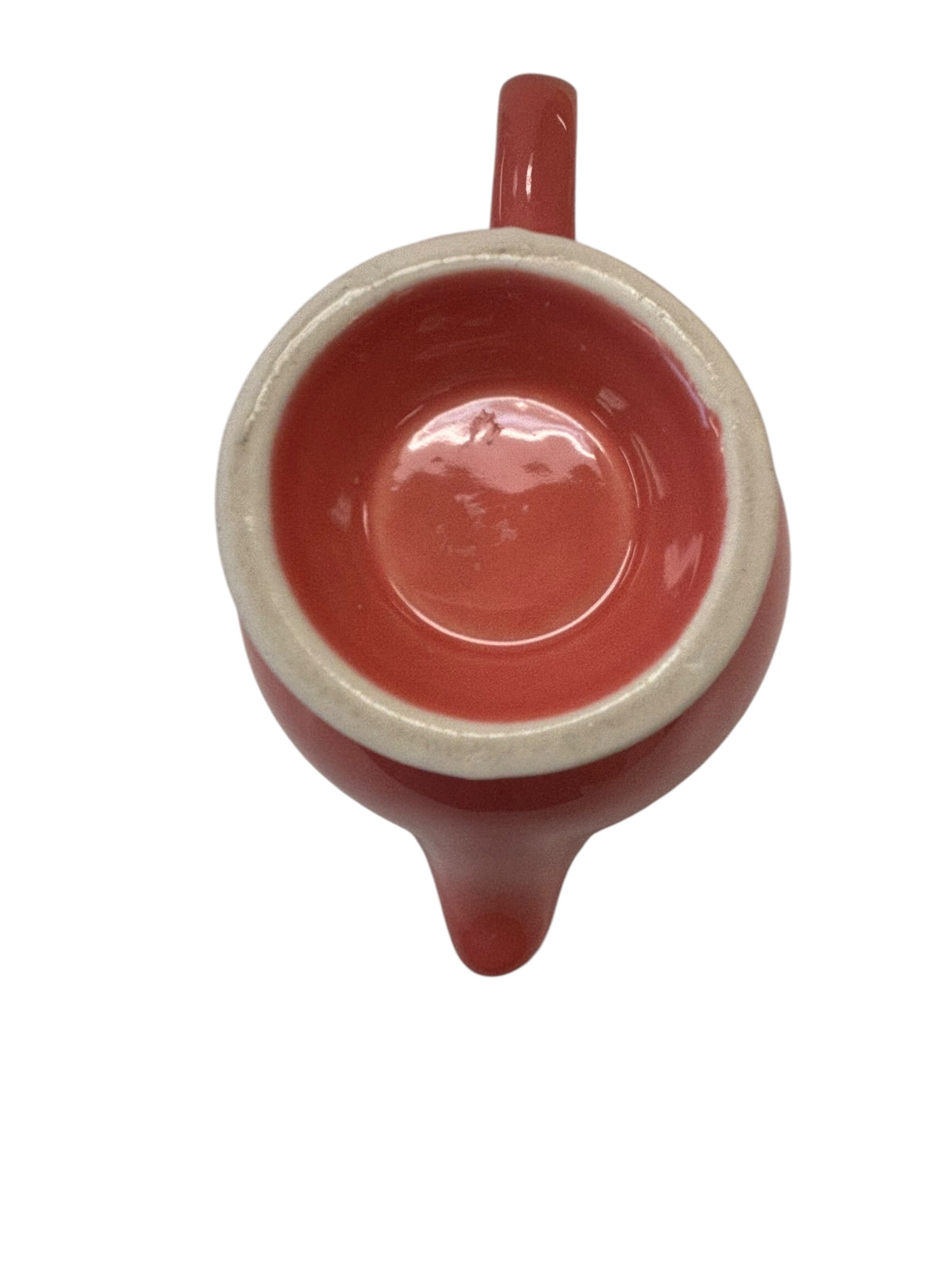This is a Fiesta Fiestaware individual cream pitcher creamer in Flamingo. lead-free, Post 1986, Retired Color Retired Shape
