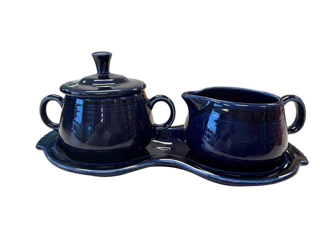 This is a Fiesta Fiestaware Creamer Pitcher Sugar Bowl with Lid on Figure Eight 8 Tray Set in cobalt lead-free, Post 1986, Retired Color Retired Shape
