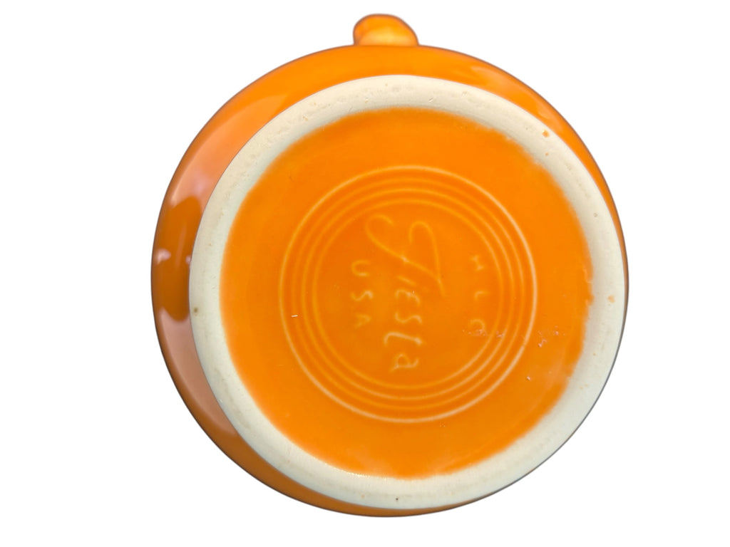 This is a Fiesta Fiestware small 60 Ounce Carafe in tangerine. Lead-free Post 1986 Retired color retired shape
