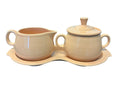 This is a Fiesta Fiestaware Creamer Pitcher Sugar Bowl with Lid on Figure Eight 8 Tray Set in apricot lead-free, Post 1986, Retired Color Retired Shape
