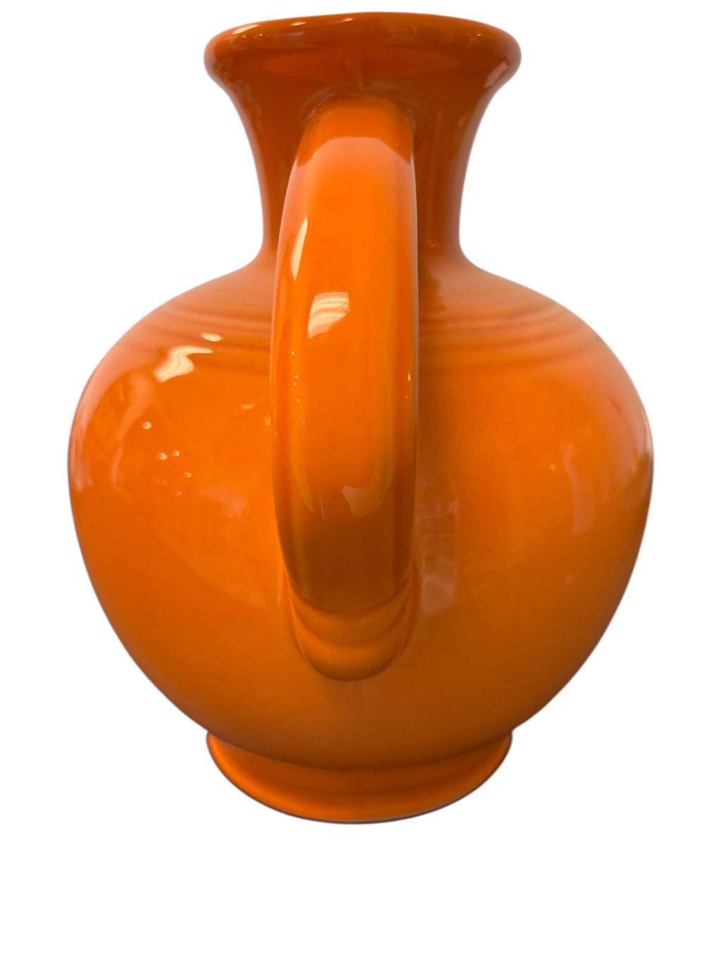 This is a Fiesta Fiestware small 60 Ounce Carafe in tangerine. Lead-free Post 1986 Retired color retired shape

