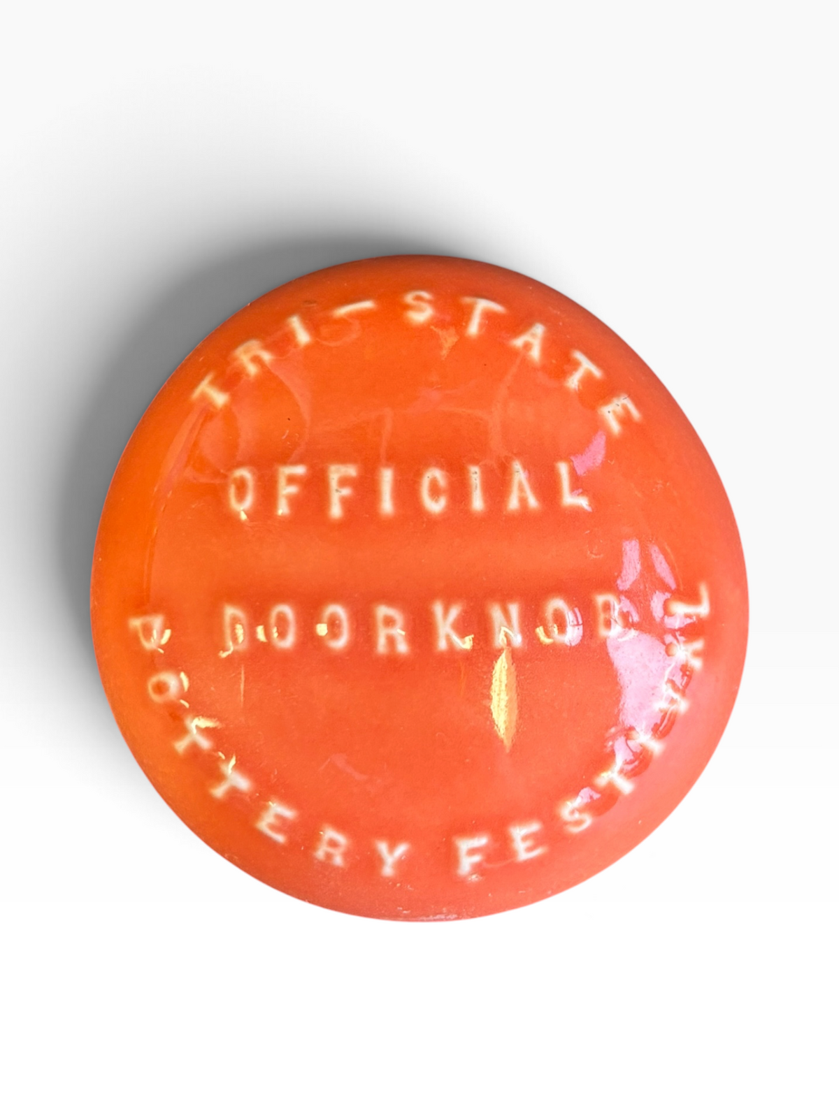 Tri-State Pottery Festival Official Doorknob in Fiesta Persimmon | HLC Toss Game