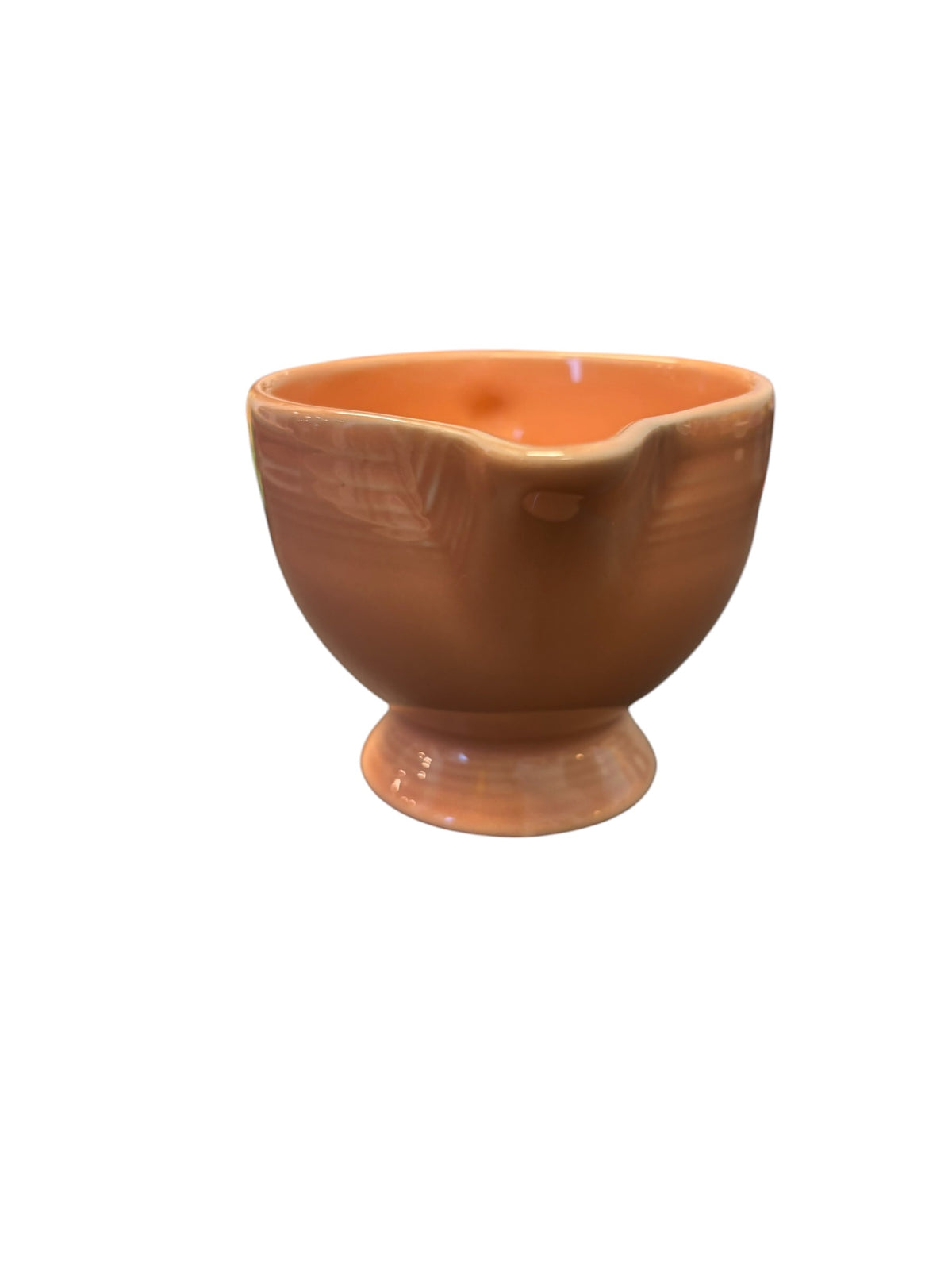 This is a Fiesta Fiestaware individual cream pitcher creamer in Apricot. lead-free, Post 1986, Retired Color Retired Shape