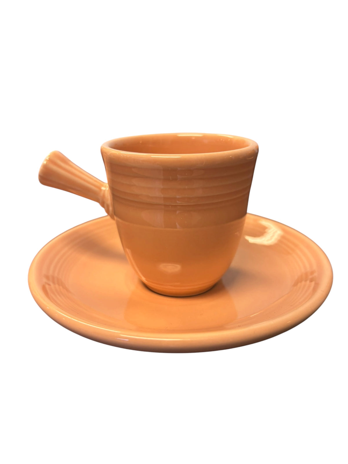 This is a Fiesta Fiestaware After Dinner AD Stick Handled Demitasse Demi Cup and Saucer Set in Apricot. lead-free, Post 1986, Retired Color Retired Shape Perfect for Espresso
