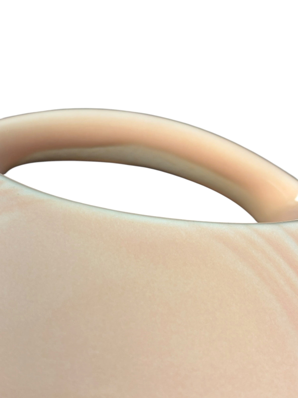 This is a Fiesta Fiestaware Small Disc Juice Pitcher in Apricot. lead-free, Post 1986, Retired Color Retired Shape 28 ounce capacity