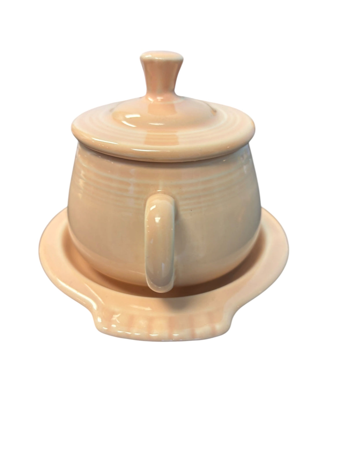 This is a Fiesta Fiestaware Creamer Pitcher Sugar Bowl with Lid on Figure Eight 8 Tray Set in apricot lead-free, Post 1986, Retired Color Retired Shape
