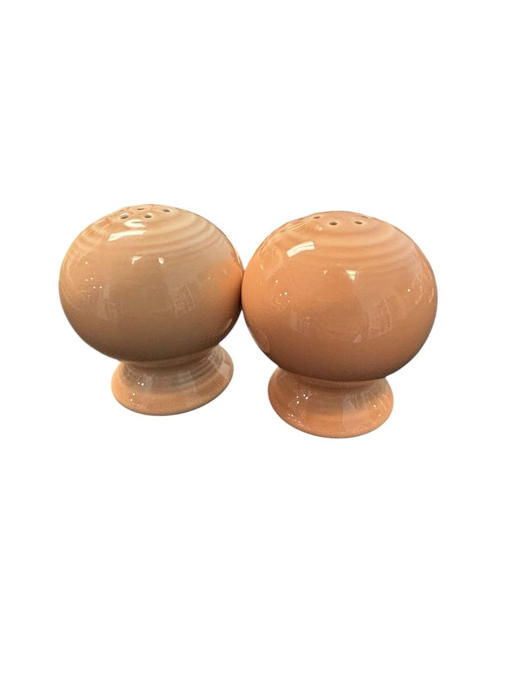 This is a Fiesta Fiestaware Bulb Shaped Salt and Pepper Shaker Set in Apricot. lead-free, Post 1986, Retired Color 